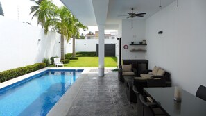 Private and heated 270 square feet pool,  terrace with dining and seating set.