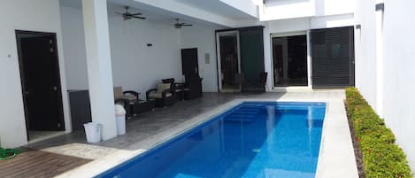 Private and heated 270 square feet pool,  terrace with dining and seating set.