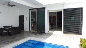 Outdoor patio adjacent to kitchen and living room