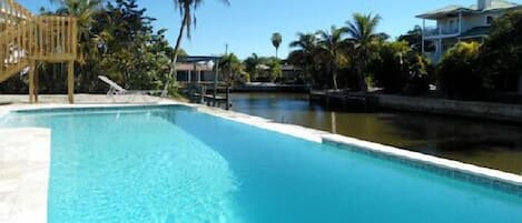 33 foot infinity pool with massage jets & underwater lights for night-time dips.