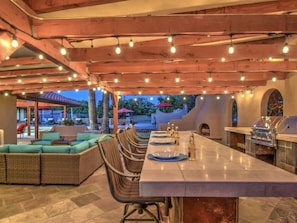Backyard has a Bar, Fireplace, Lounge Area, Full Kitchen & Much More