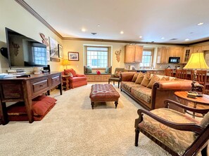 Gather together at the bar, sofa, and dining table