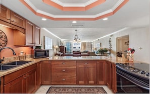 Kitchen with all the amenities; stovetop and oven pictured here