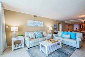 Spacious coastal living room/den area with 50" TV