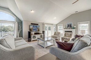 Top-Level Living Room with Deck Access