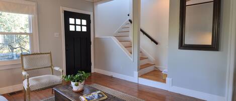 Front Entrance and Living Room with staircase to 2 story.