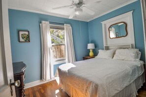 Downstairs Bedroom #2 is cozy and cool with a Queen size bed and antique dresser