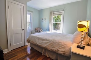 Downstairs Bedroom #1 is pretty and bright with an antique secretary (not shown)
