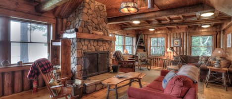 Living room with large stone fireplace