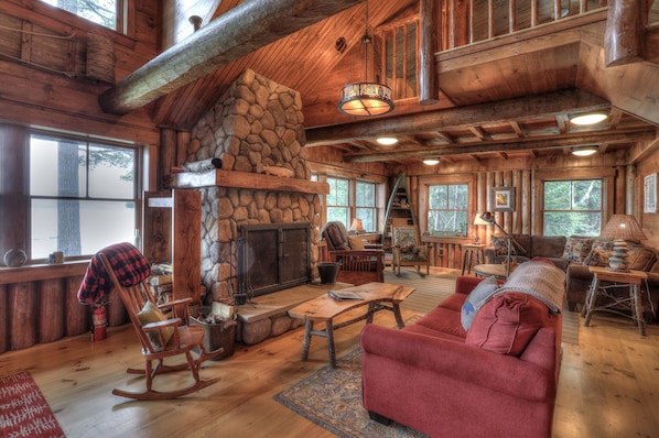 Living room with large stone fireplace