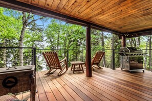 Spacious partly-covered deck overlooking the lake with gas grill