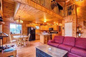 Living room with view of dining are and kitchen
