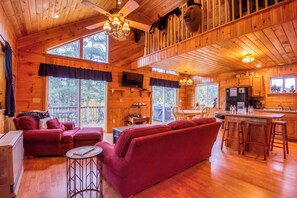Open floor plan with a warm wooden finish and lots of natural light