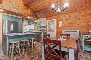 Front door leading into the kitchen and dining area