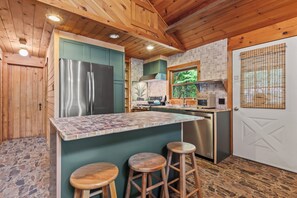 Freshly remodeled and fully equipped kitchen, with island seating for 3