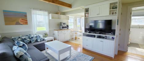 Living room with eat-in kitchen beyond