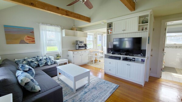 Living room with eat-in kitchen beyond