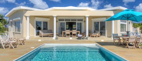 Pool deck, outdoor living and dining area.