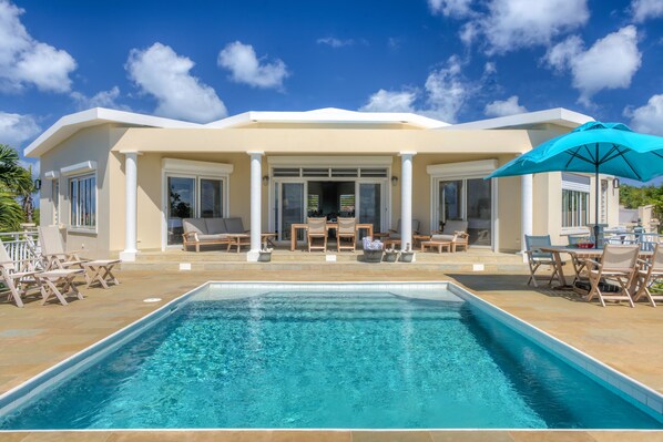 Pool deck, outdoor living and dining area.