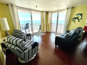 Sitting area with double reclining sofa and swivel rocking chairs