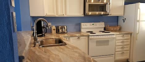 Newly remodeled and well stocked kitchen 