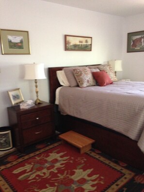 Master bedroom with bathroom and porch with a beautiful view to awaken to.