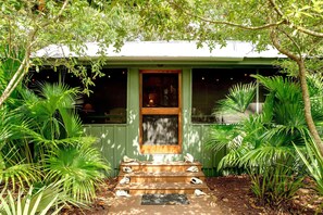 Travel a well-lit walkway and enter through the front porch