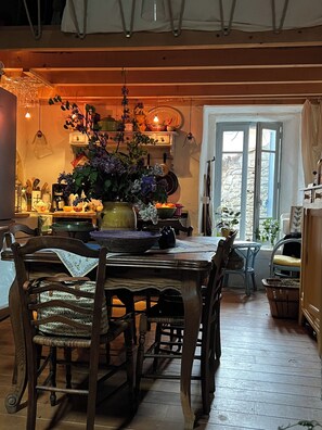 Dining room kitchen area. Window sitting area looks over the courtyard entrance.