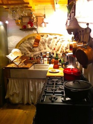 Gas stove and antique apron front marble sink, copper pans, all new appliances