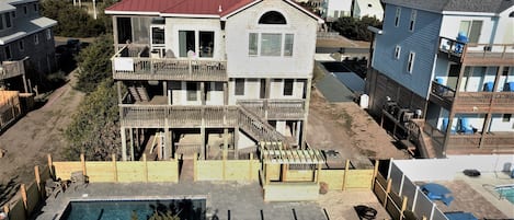 Rear elevation, new pool, 2 deck levels, screened porch.  