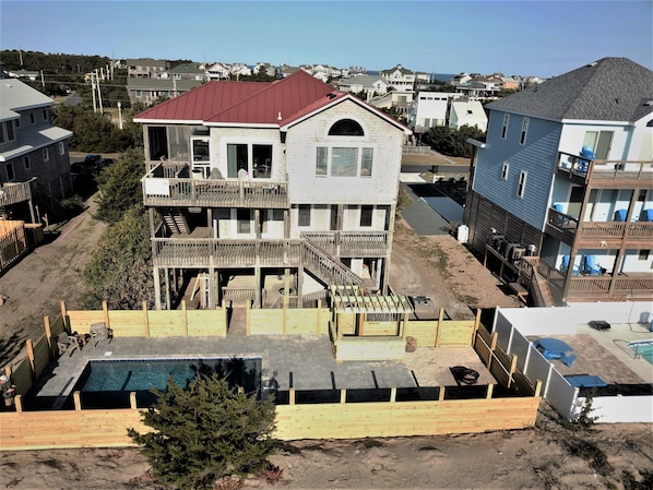 Rear elevation, new pool, 2 deck levels, screened porch.  