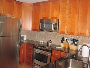 Brand new kitchen with granite countertops and stainless steel appliances!