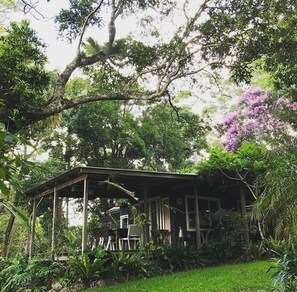 view to the deck from the garden - perfect breakfast spot