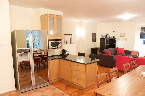 Kitchen towards living room and office desk
