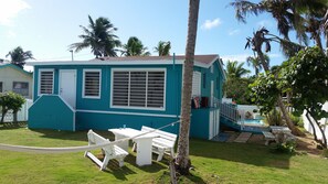 Cozy 3 bedroom bungalow has a peaceful yard to relax in & enjoy sound of waves