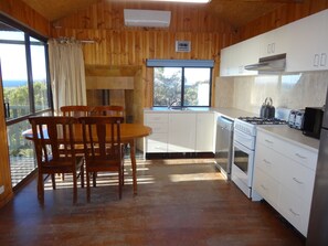 Kitchen, dinning area with reverse cycle  and potbelly