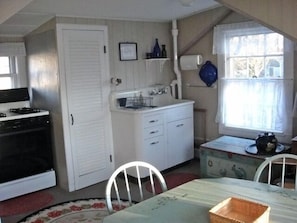Eat-in kitchen; full sized appliances; antique sink; 1/2 bath through door