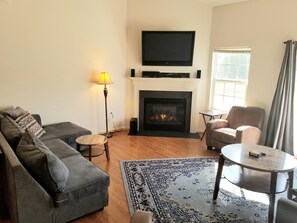 Living room view 2 w/ fireplace.