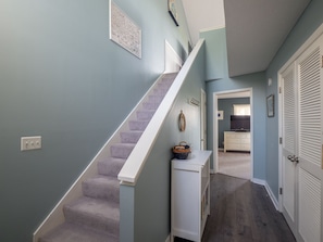 Entrance into reverse floor plan with bedrooms on lower level