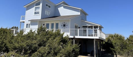 Side view of house and driveway (brand new decks, cable railing and new color!)