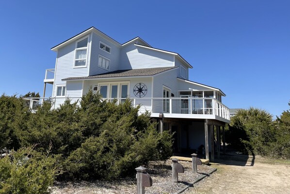 Side view of house and driveway (brand new decks, cable railing and new color!)