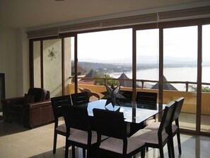 Dining area opening up to gorgeous view of Bandaras Bay off of Balcony