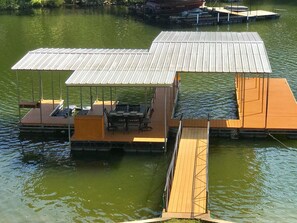 Dock with large 30 foot slip and two pull up jet ski lifts.
