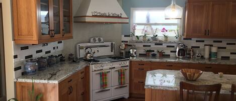 Beautifully remodeled kitchen with a fully restored 1950's Wedgewood stove.