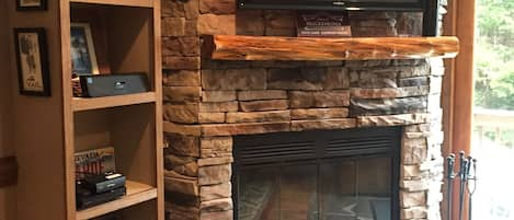 NEW wood burning fire place w/ large flat screen tv & entertainment center!