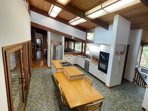 Spacious, fully stocked kitchen with new fridge, dishwasher and gas range