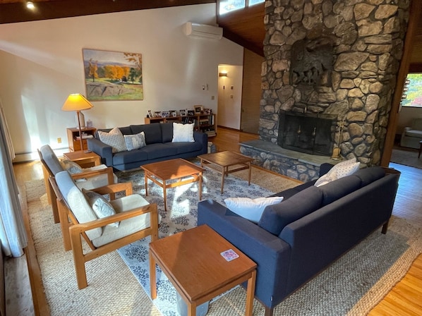 Living room with stone surround fireplace
