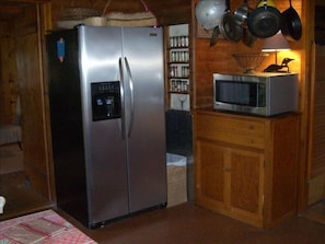Country kitchen featuring modern appliances.