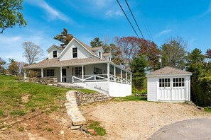 Driveway area with spacious newly renovated garage sitting room