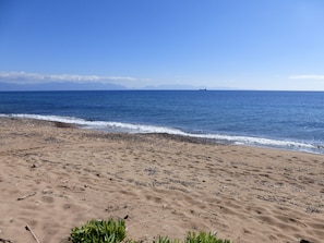 This is the beach with golden sand and crystal clear  shalow waters